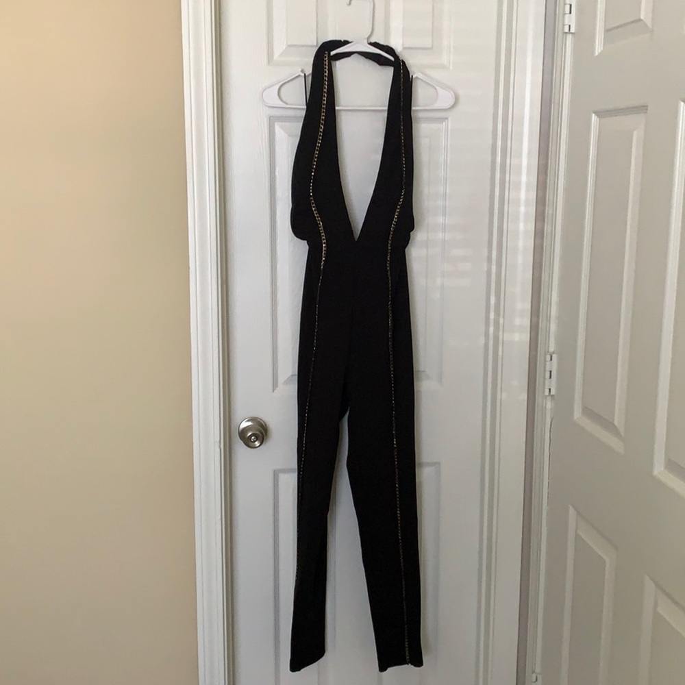 Black jumpsuit with gold chains